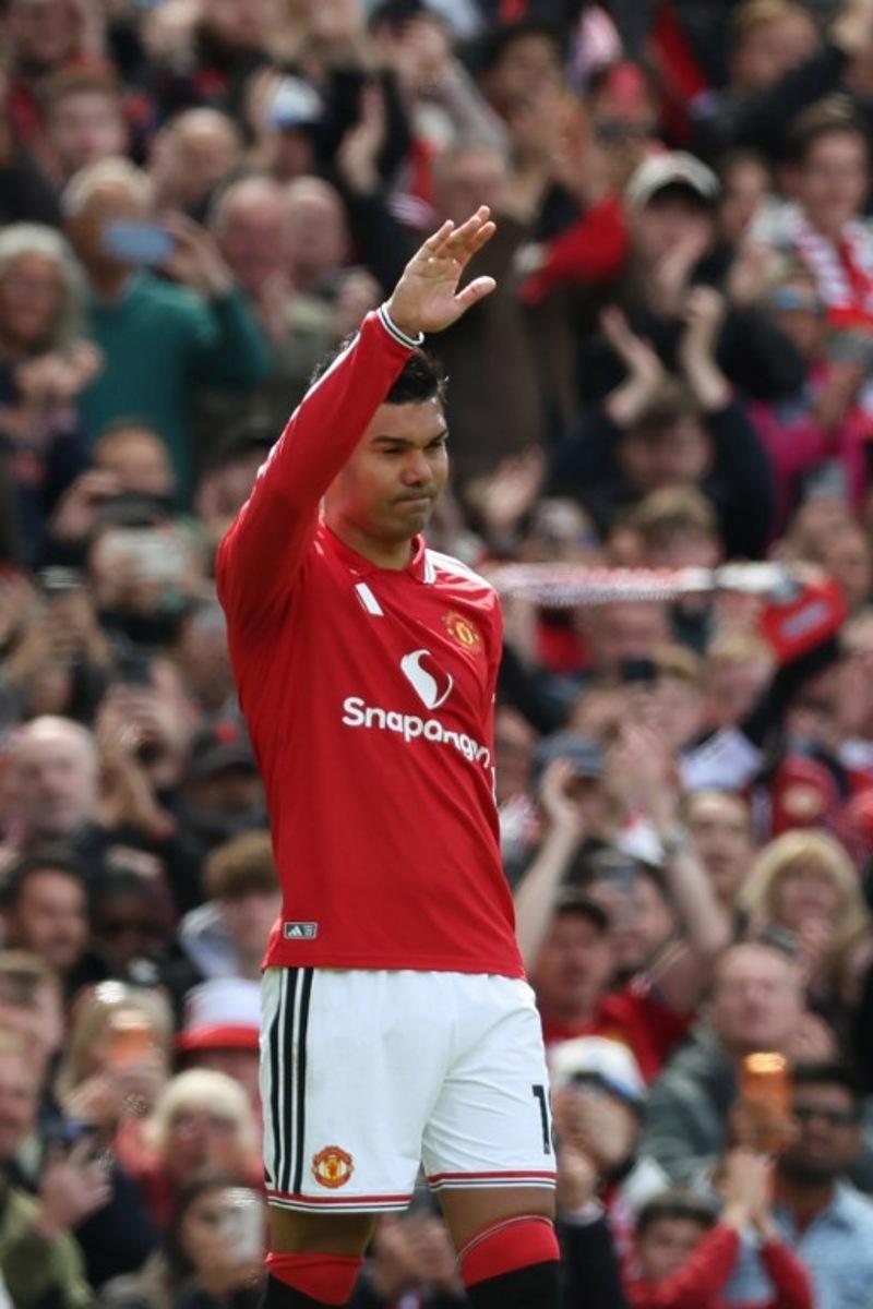 Manchester United's Brazilian midfielder #18 Casemiro gestures to supporters as he leaves the game sunstituted on his final home appearance during the English Premier League football match between Manchester United and Nottingham Forest at Old Trafford in Manchester, north west England, on May 17, 2026. Darren Staples / AFP