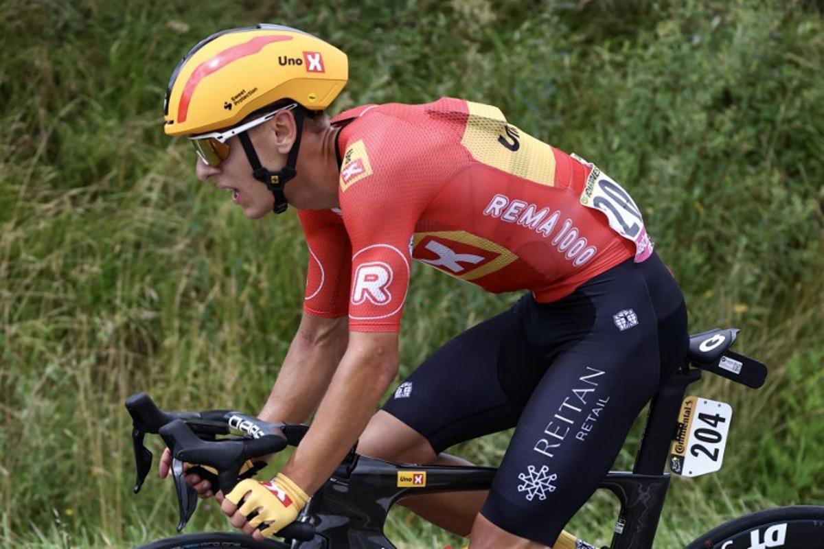 Uno-X Mobility team's Norwegian rider Tobias Halland Johannessen cycles ahead of the pack of riders (peloton) during the 13th stage of the 111th edition of the Tour de France cycling race, 165,3 km between Agen and Pau, southwestern France, on July 12, 2024. Anne-Christine POUJOULAT / AFP