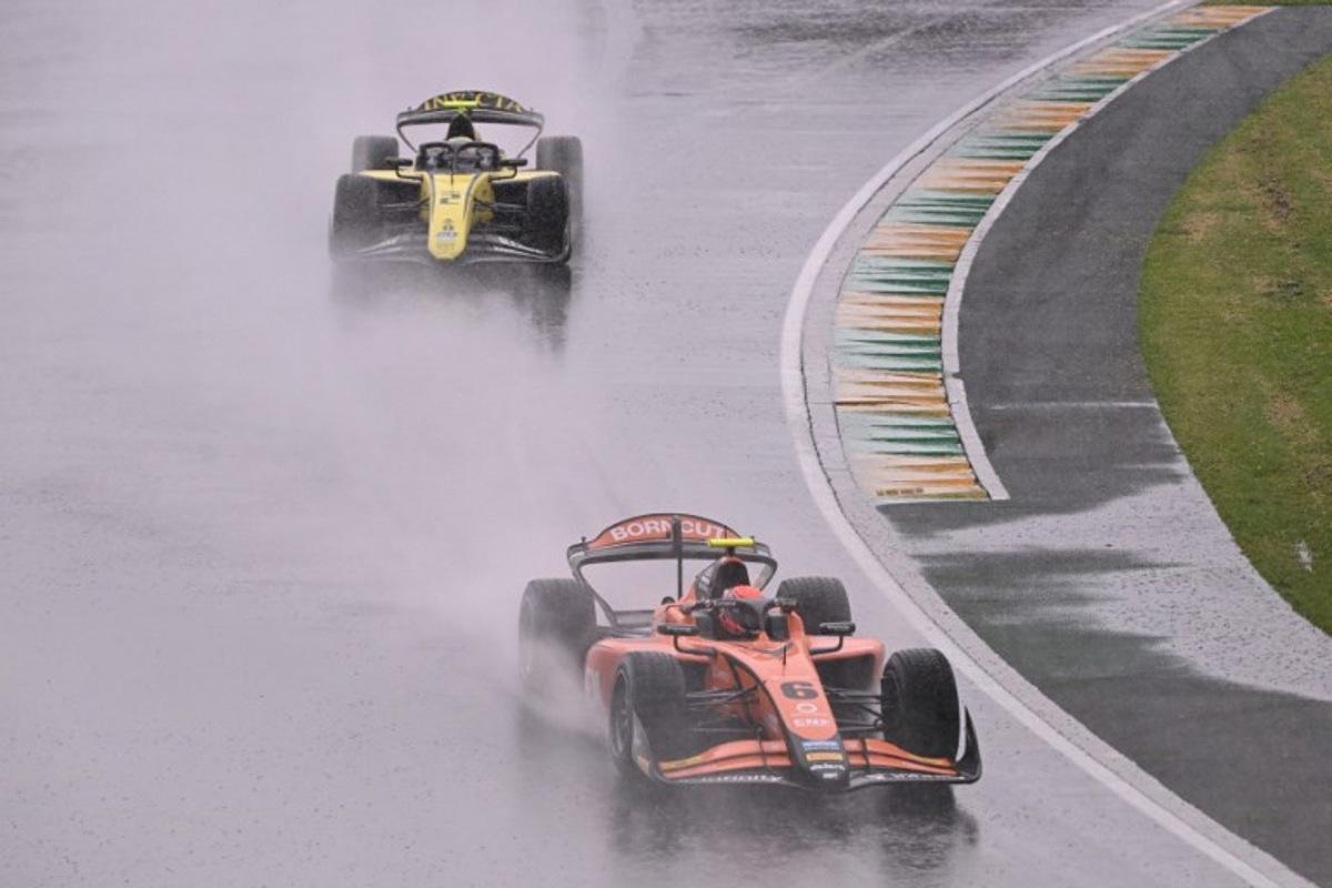 Formula 2 MP Motorsport's Dutch driver Richard Verschoor (R) and other drivers take part in a parade before the Australian Formula One Grand Prix at Albert Park Circuit in Melbourne on March 16, 2025. WILLIAM WEST / AFP
