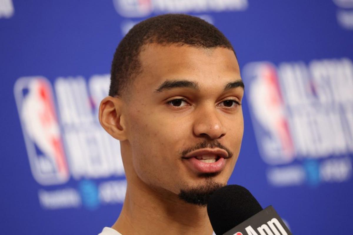 French basketball player Victor Wembanyama of the San Antonio Spurs speaks to the media during the NBA All-Star media day at the Intuit Dome in Inglewood, California, on February 14, 2026. Patrick T. Fallon / AFP