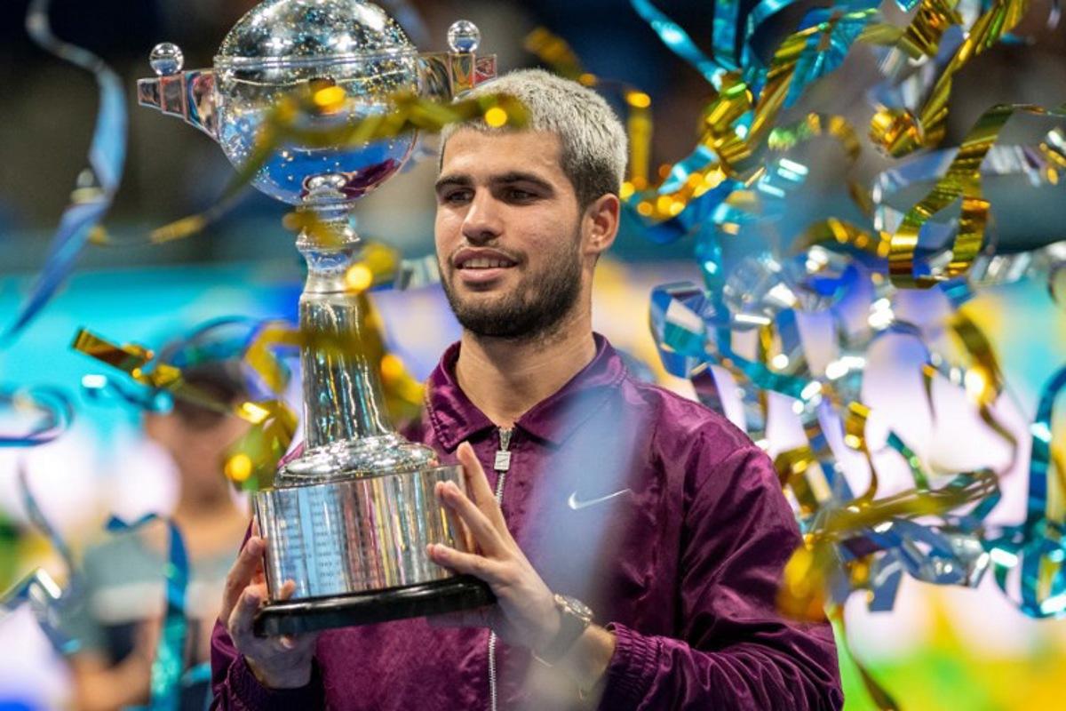 Spain's Carlos Alcaraz celebrates during the award ceremony after winning the men's singles final match against USA's Taylor Fritz at the ATP Japan Open tennis tournament in Tokyo on September 30, 2025. Philip FONG / AFP