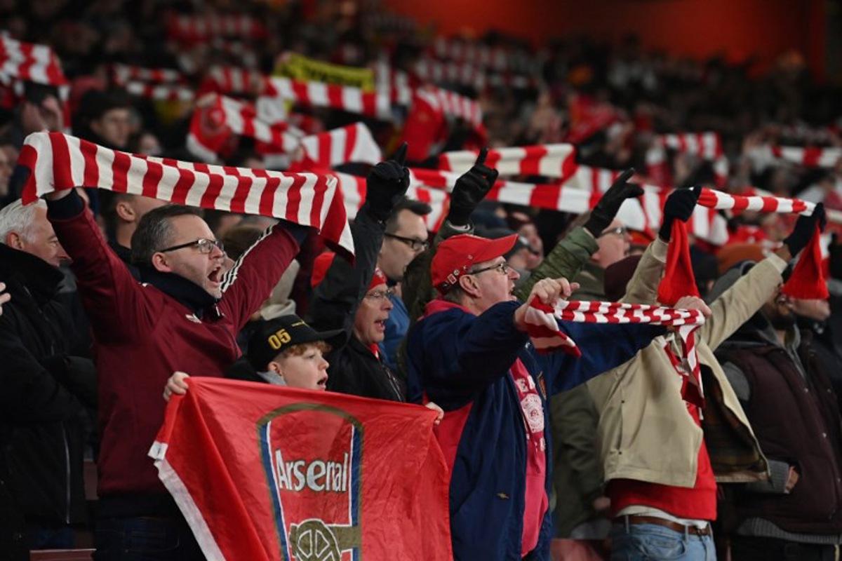 Arsenal fans sing in the crowd ahead of the English Premier League football match between Arsenal and Aston Villa at the Emirates Stadium in London on January 18, 2025. Glyn KIRK / AFP