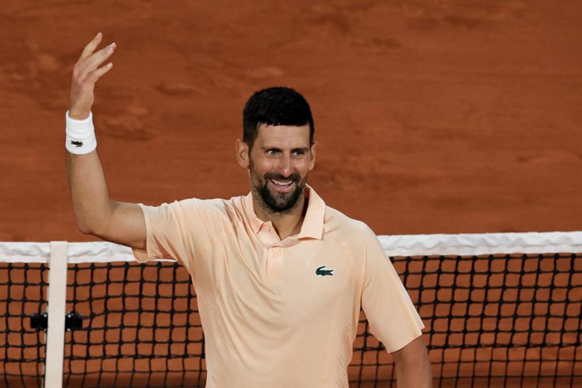 Serbia's Novak Djokovic celebrates after winning the second set as he plays against France's Giovanni Mpetshi Perricard during their men's singles match on day 1 of the French Open tennis tournament on Court Philippe-Chatrier at the Roland-Garros Complex in Paris on May 24, 2026. Thomas SAMSON / AFP