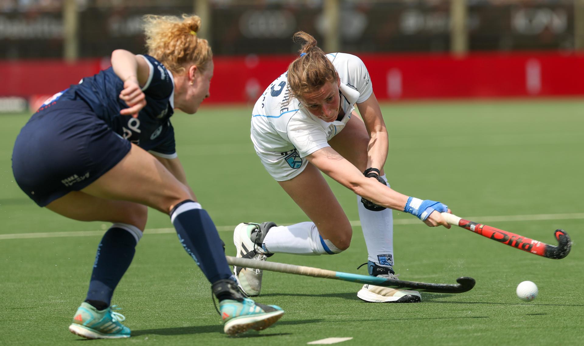 Gantoise's Michelle Struijk and Braxgata's Stephanie Vanden Borre pictured in action during a hockey game between Gantoise and Braxgata, Sunday 12 May 2024 in Antwerp, the return leg of the finals of the playoffs in the Belgian Hockey League women during the 2023-2024 season. BELGA PHOTO VIRGINIE LEFOUR