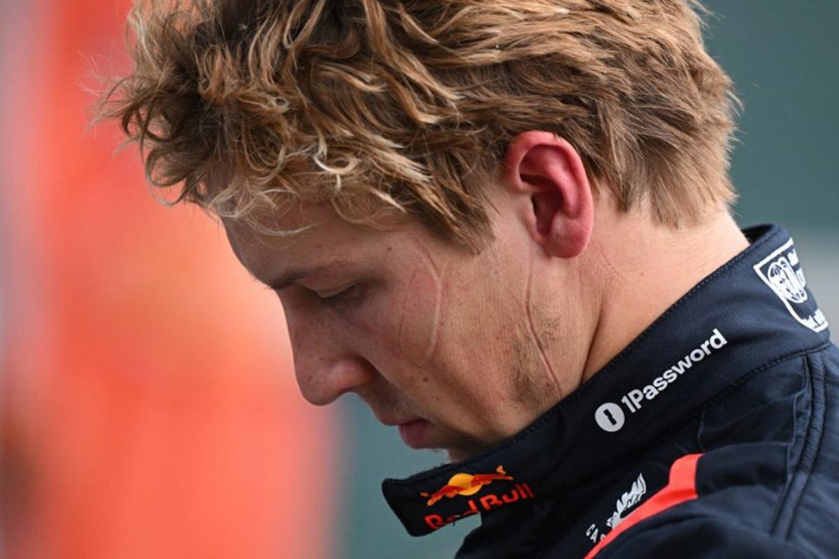 (FILES) Red Bull Racing's New Zealand driver Liam Lawson walks back to his team garage after getting out of his car at the end of the Formula One Chinese Grand Prix in Shanghai on March 23, 2025. Red Bull said on March 27, 2025 that Liam Lawson has been axed and replaced by Yuki Tsunoda, confirming days of speculation and just two race weekends into the F1 season. GREG BAKER / AFP