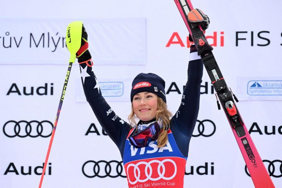 Winner US' Mikaela Shiffrin celebrates on the podium after the Women' Slalom event of FIS Alpine Skiing World Cup in Spindleruv Mlyn, Czech Republic on January 25, 2026. Michal Cizek / AFP