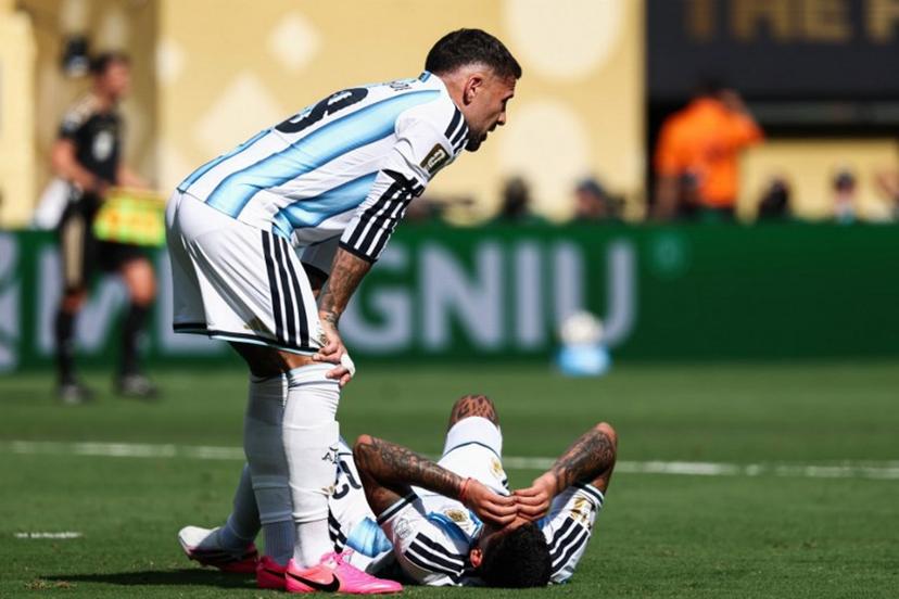 Argentina's defender #13 Cristian Romero (R) lies on the field past defender #19 Nicolas Otamendi during the 2026 World Cup football tournament final match between Spain and Argentina at the New York/New Jersey Stadium in East Rutherford on July 19, 2026. FRANCK FIFE / AFP