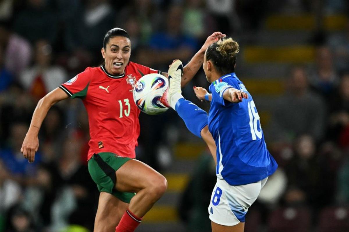 Portugal's midfielder #13 Fatima Pinto (L) and Italy's midfielder #18 Arianna Caruso (R) fight for the ball during the UEFA Women's Euro 2025 Group B football match between Portugal and Italy at the Stade de Geneve in Geneva, on July 7, 2025. Fabrice COFFRINI / AFP