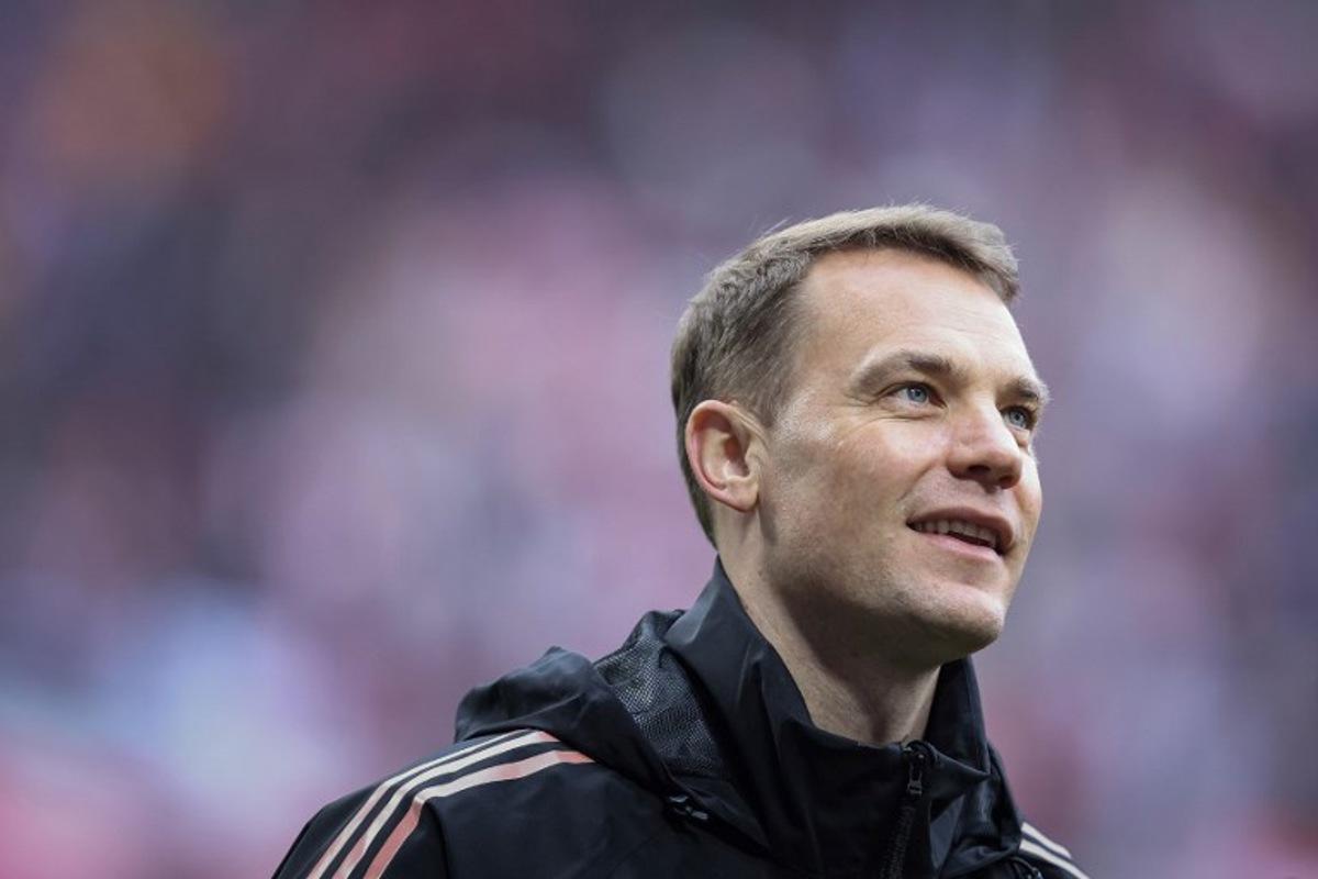 Bayern Munich's German goalkeeper #01 Manuel Neuer smiles after the German first division Bundesliga football match between RB Leipzig and FC Bayern Munich in Leipzig, eastern Germany on May 3, 2025. Ronny Hartmann / AFP