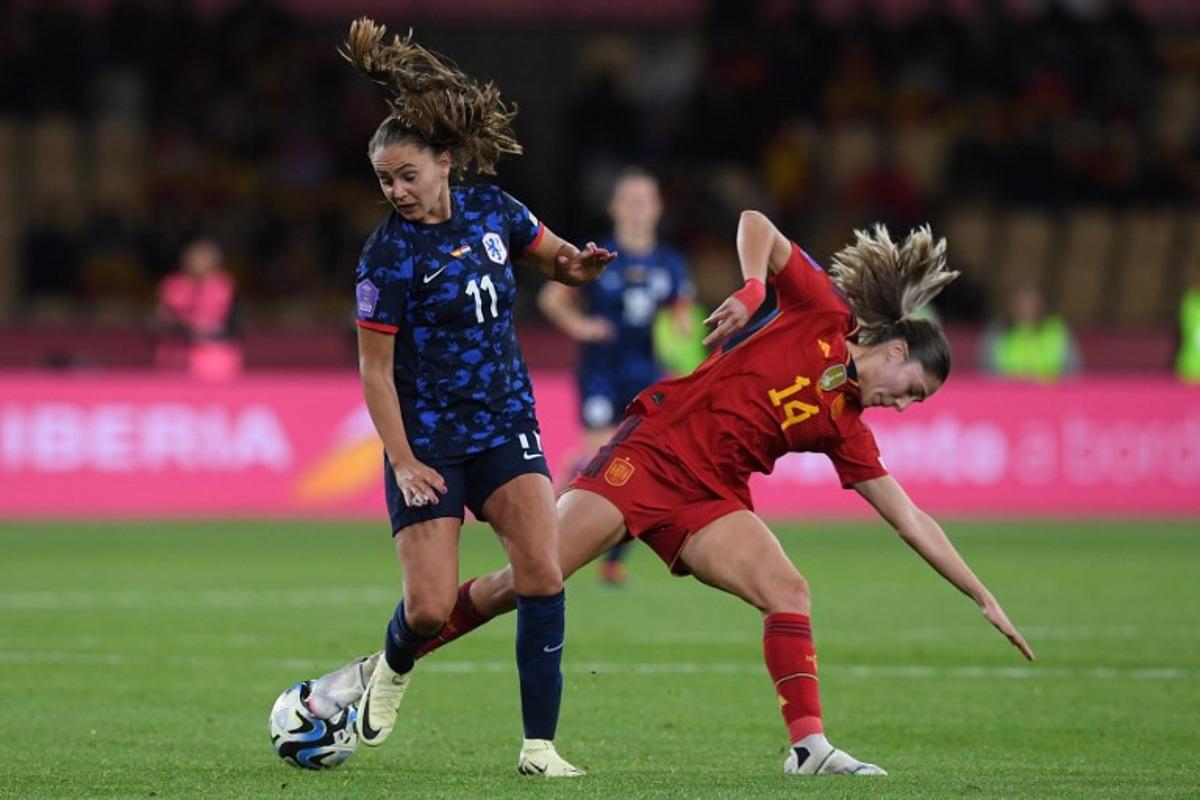 Netherlands' forward #11 Lieke Martens vies with Spain's defender #14 Laia Aleixandri during the UEFA Women's Nations League semi-final football match between Spain and Netherlands at the La Cartuja stadium in Seville, on February 23, 2024. JORGE GUERRERO / AFP