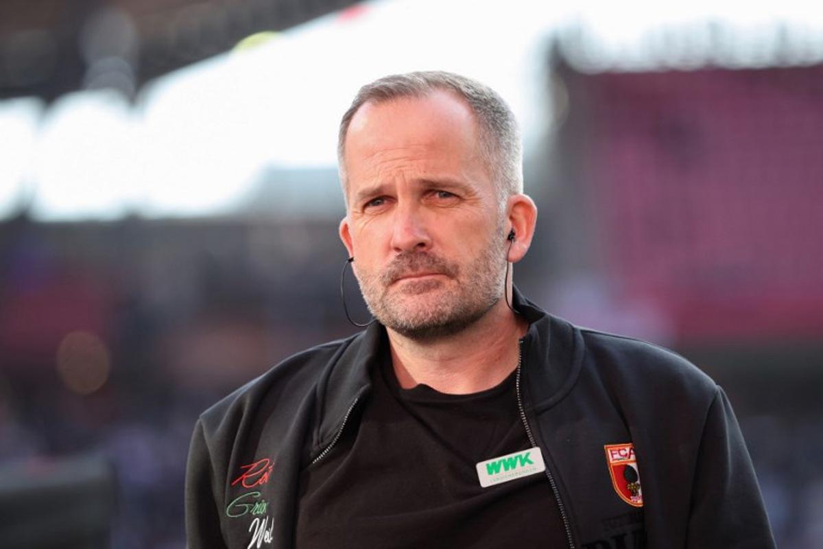 Augsburg's German head coach Manuel Baum arrives for the Bundesliga football match between RB Leipzig and Augsburg in Leipzig, eastern Germany, on March 7, 2026. Ronny HARTMANN / AFP