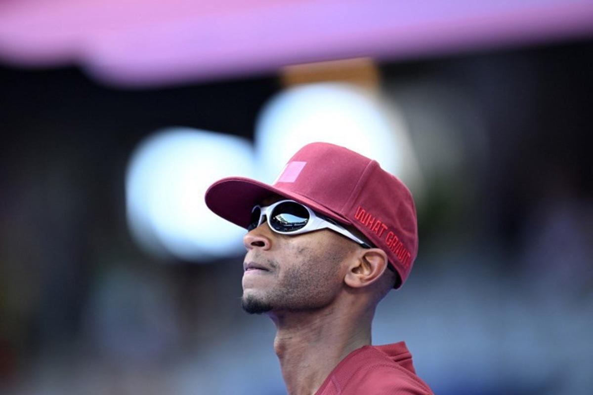 Qatar's Mutaz Essa Barshim gets ready prior to the men's high jump final of the athletics event at the Paris 2024 Olympic Games at Stade de France in Saint-Denis, north of Paris, on August 10, 2024. Kirill KUDRYAVTSEV / AFP