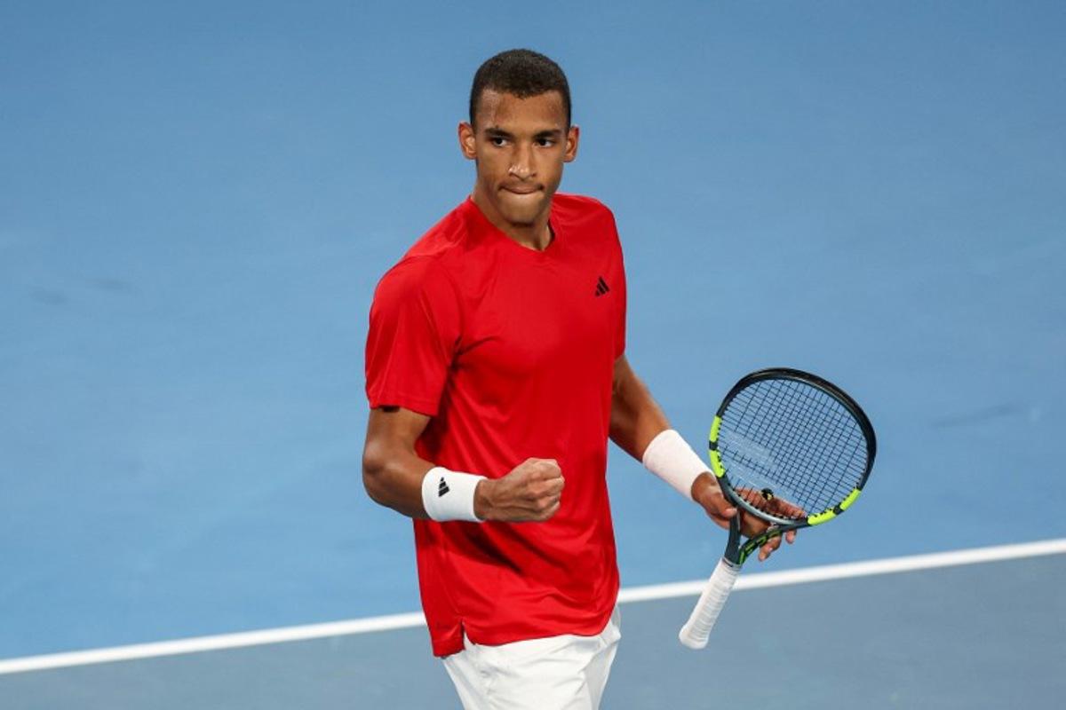 Canada's Felix Auger-Aliassime celebrates after his victory against China's Zhang Zhizhen at their men's singles match during the United Cup tennis tournament in Ken Rosewall Arena, Sydney on January 4, 2026. Izhar KHAN / AFP