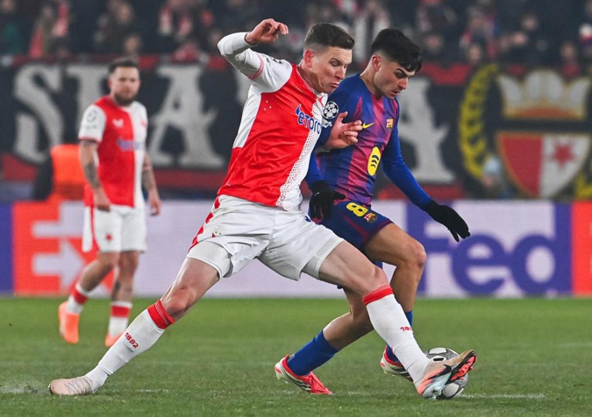 Barcelona's Spanish midfielder #08 Pedri (R) vies for the ball during in the UEFA Champions League football match between Slavia Prague (CZE) and FC Barcelona (ESP) in Prague, Czech Republic on January 21, 2026. Michal Cizek / AFP