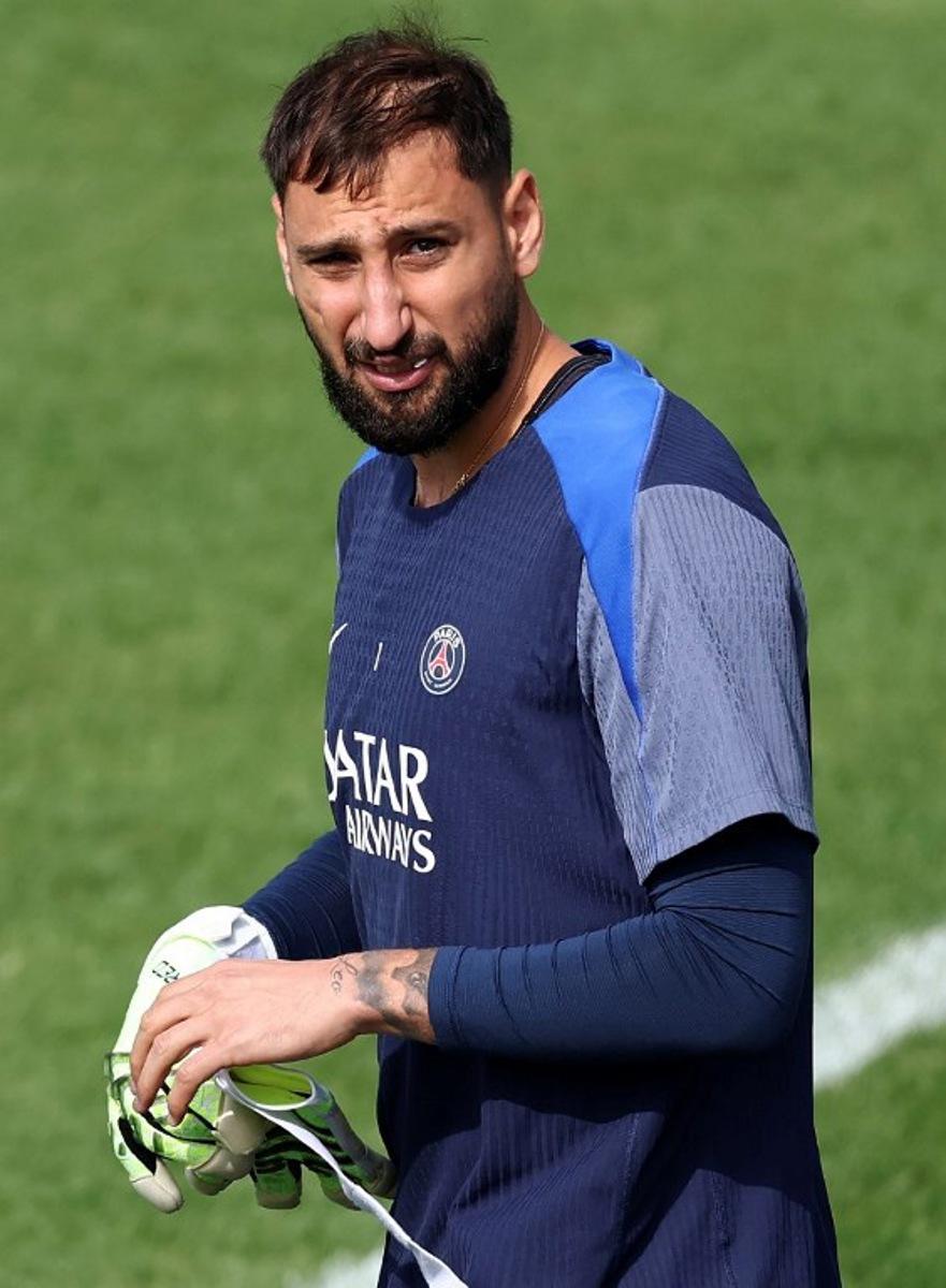Paris Saint-Germain's Italian goalkeeper Gianluigi Donnarumma arrives for a training session at French L1 Paris Saint-Germain (PSG) football club's training ground at Poissy, north-west of Paris on August 21, 2025, on the eve of the L1 football match PSG against SCO Angers. FRANCK FIFE / AFP
