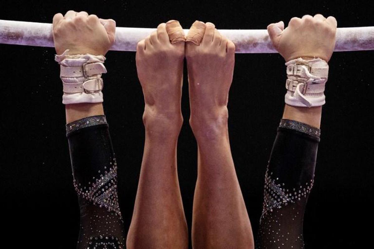Italy's Asia D'amato competes in the uneven bars event at the women¿s team qualification during the Artistic Gymnastics World Championships at the Kitakyushu City Gymnasium in Kitakyushu, Fukuoka prefecture on October 18, 2021. Philip FONG / AFP