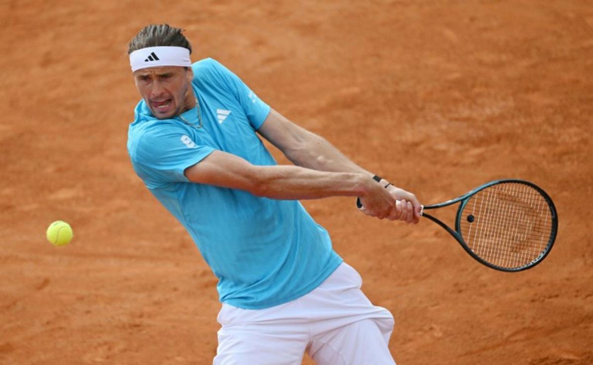 Germany's Alexander Zverev hits a return to Italy's Luciano Darderi during the ATP Rome Open tennis tournament at Foro Italico in Rome on May 12, 2026. Andreas SOLARO / AFP