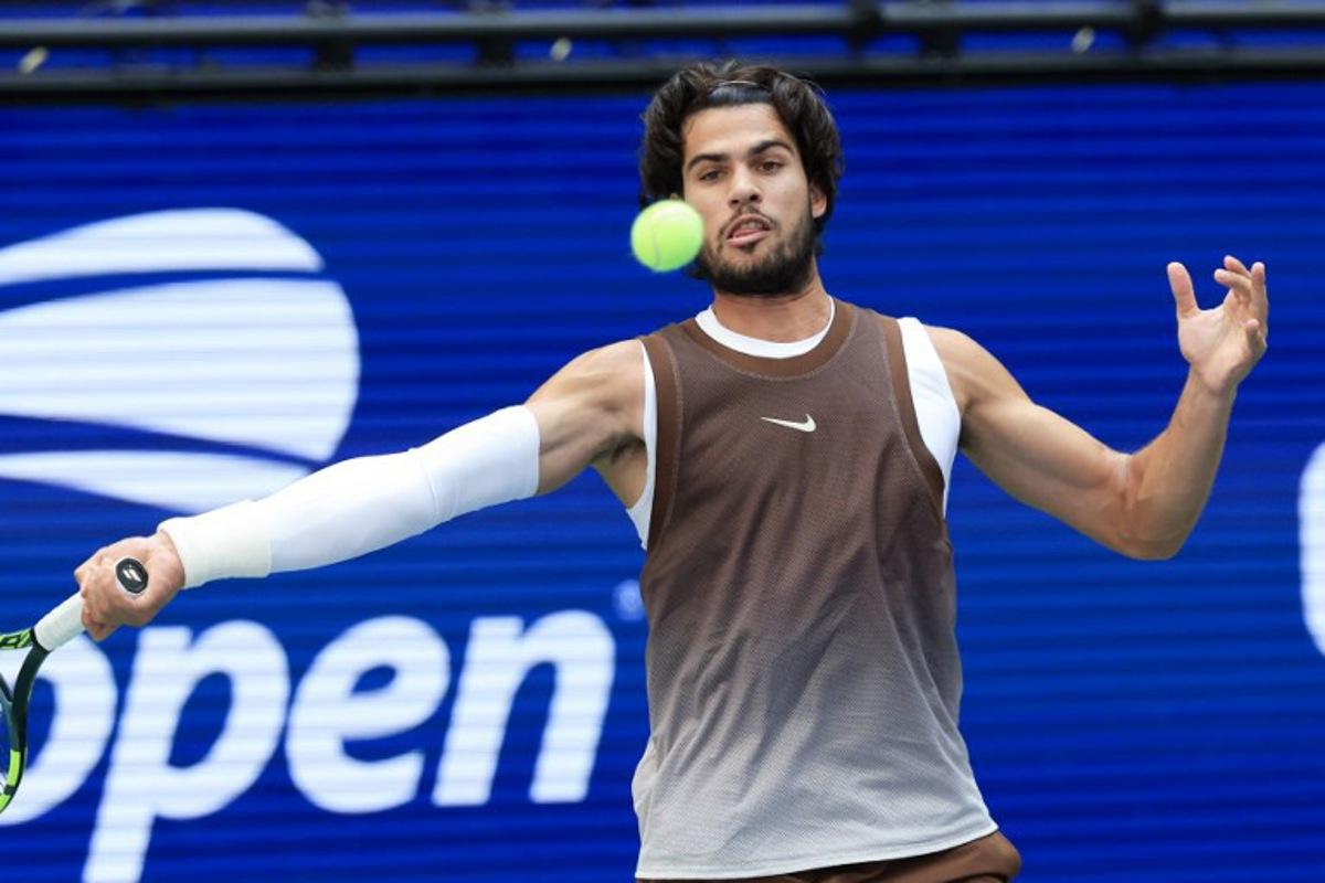 Spain's Carlos Alcaraz hits a return to China's Wu Yibing during their men's singles third round tennis match on day six of the US Open tennis tournament at the USTA Billie Jean King National Tennis Center in New York City on September 4, 2026. TIMOTHY A. CLARY / AFP