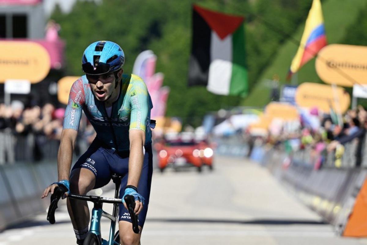 XDS Astana Team's Italian rider Christian Scaroni celebrates after victory as he crosses the finish line of the 16th stage of the 108th Giro d'Italia cycling race of 203kms from Piazzola sul Brenta to San Valentino on May 27, 2025. Ivan Benedetto / AFP