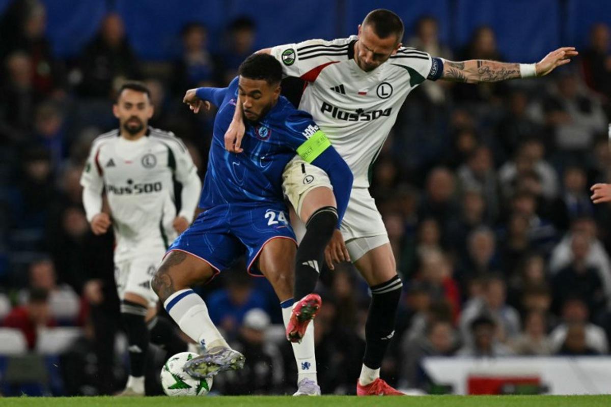 Chelsea's English defender #24 Reece James (L) vies with Legia Warszawa's Czech forward #07 Tomas Pekhart (R) during the UEFA Europa Conference League quarter-final, second leg football match between Chelsea and Legia Warsaw at Stamford Bridge in London on April 17, 2025. Glyn KIRK / AFP