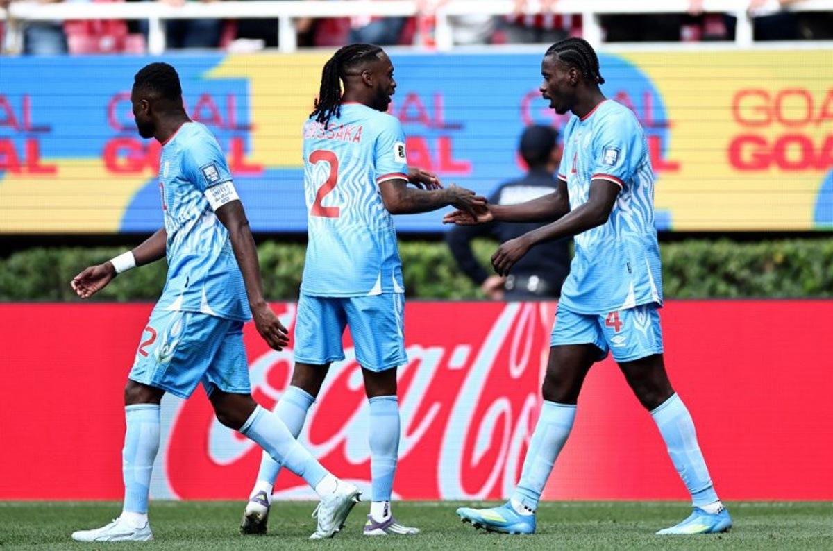 DR Congo's defender #04 Axel Tuanzebe (R) celebrates with teammate defender #02 Aaron Wan-Bissaka after scoring a goal in extra time during the 2026 FIFA World Cup qualifiers final playoff football match between the Democratic Republic of the Congo and Jamaica at the Akron Stadium in Zapopan, Jalisco state, Mexico, on March 31, 2026. Ulises Ruiz / AFP