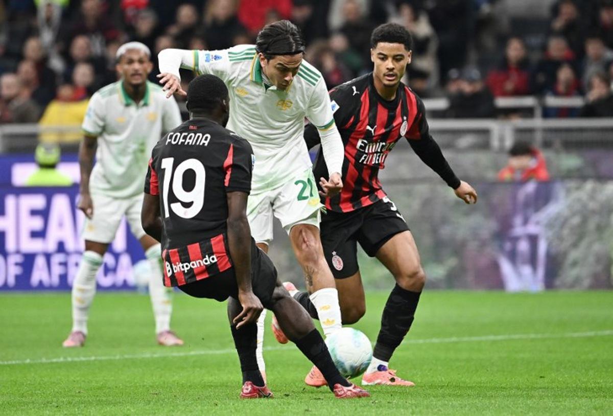 Roma's Argentine forward #21 Paulo Dybala (C) fights for the ball with AC Milan's French midfielder #19 Youssouf Fofana (L) and AC Milan's Belgian defender #05 Koni De Winter (R) during the Italian Serie A football match between AC Milan and AS Roma at San Siro stadium in Milan, on November 2, 2025. Isabella BONOTTO / AFP