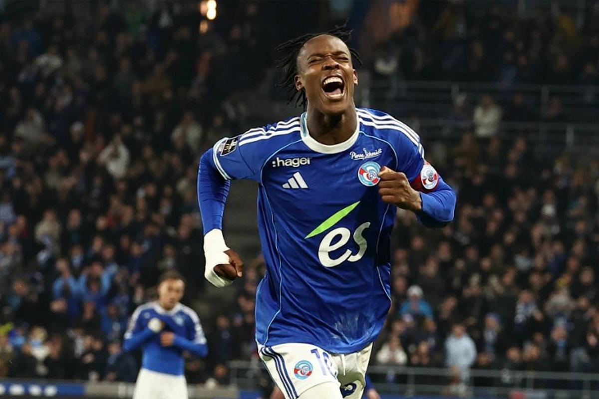 Strasbourg's Dutch forward #10 Emanuel Emegha celebrates after scoring his team's second goal during the French L1 football match between RC Strasbourg Alsace and Lille LOSC at the Stade de la Meinau in Strasbourg, eastern France, on November 9, 2025. Frederick FLORIN / AFP