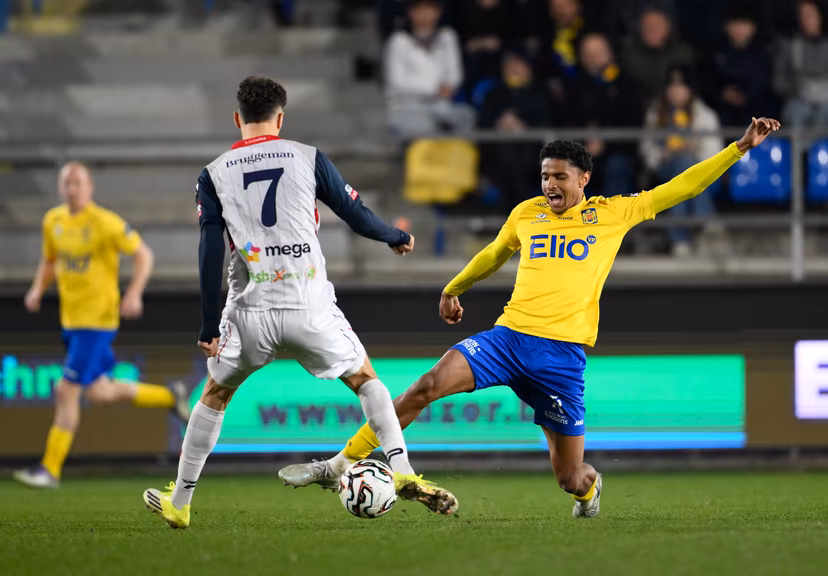 Liege's Benoit Bruggeman and Beveren's Yoni Gomis fight for the ball during a soccer game between SK Beveren and RFC Liege, Saturday 21 March 2026 in Beveren, on day 31 of the 2025-2026 'Challenger Pro League' 1B second division of the Belgian championship. BELGA PHOTO JOHN THYS