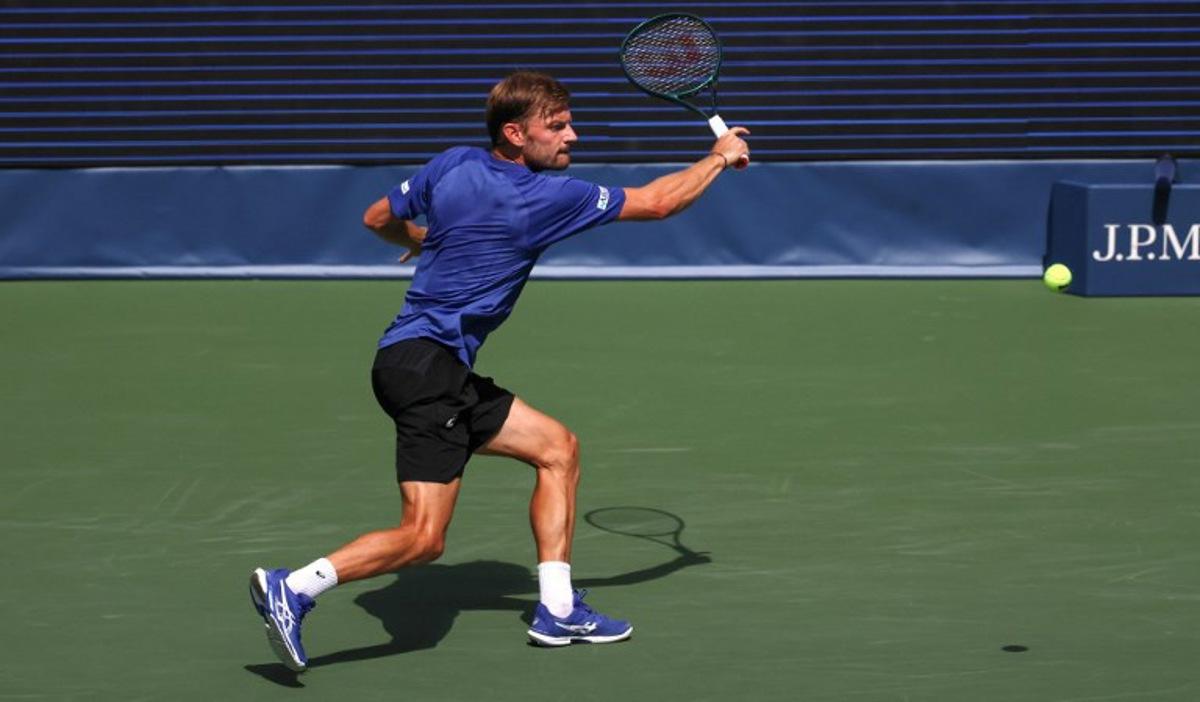 Belgium's David Goffin plays a backhand return to Italy's Lorenzo Musetti during their men's singles second round tennis match on day five of the US Open tennis tournament at the USTA Billie Jean King National Tennis Center in New York City, on August 28, 2025. TIMOTHY A. CLARY / AFP