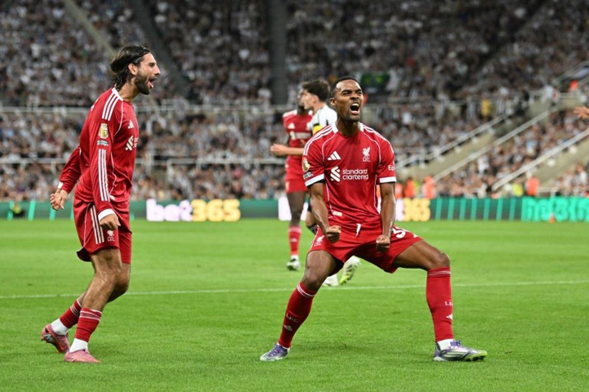 Liverpool's Dutch midfielder #38 Ryan Gravenberch (C) celebrates after scoring the opening goal of the English Premier League football match between Newcastle United and Liverpool at St James' Park in Newcastle-upon-Tyne, north east England on August 25, 2025. ANDY BUCHANAN / AFP