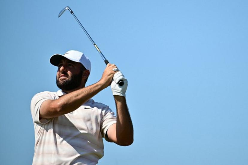 US golfer Scottie Scheffler watches his iron shot from the 12th tee on day four of the 154th Open Golf championship at Royal Birkdale Golf Club near Southport in north-west England on July 19, 2026. Ben STANSALL / AFP