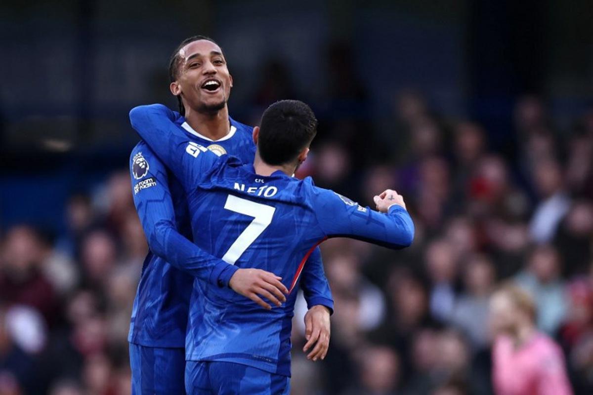 Chelsea's Brazilian striker #20 Joao Pedro celebrates scoring the team's first goal alongside Chelsea's Portuguese midfielder #07 Pedro Neto during the English Premier League football match between Chelsea and Brentford at Stamford Bridge in London on January 17, 2026. Henry NICHOLLS / AFP
