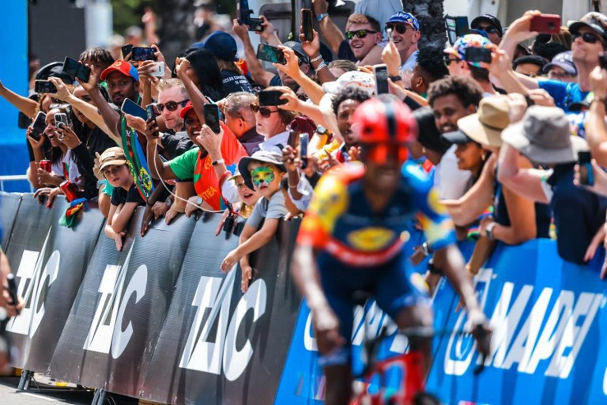 Eritrea fans cheer Team Lidl-Trek's Natnael Tesfatsion of Eritrea towards the sprint finish during the 2024 Men's Elite Cadel Evans Great Ocean Road Race cycling event in Geelong on January 28, 2024. CHRIS PUTNAM / AFP