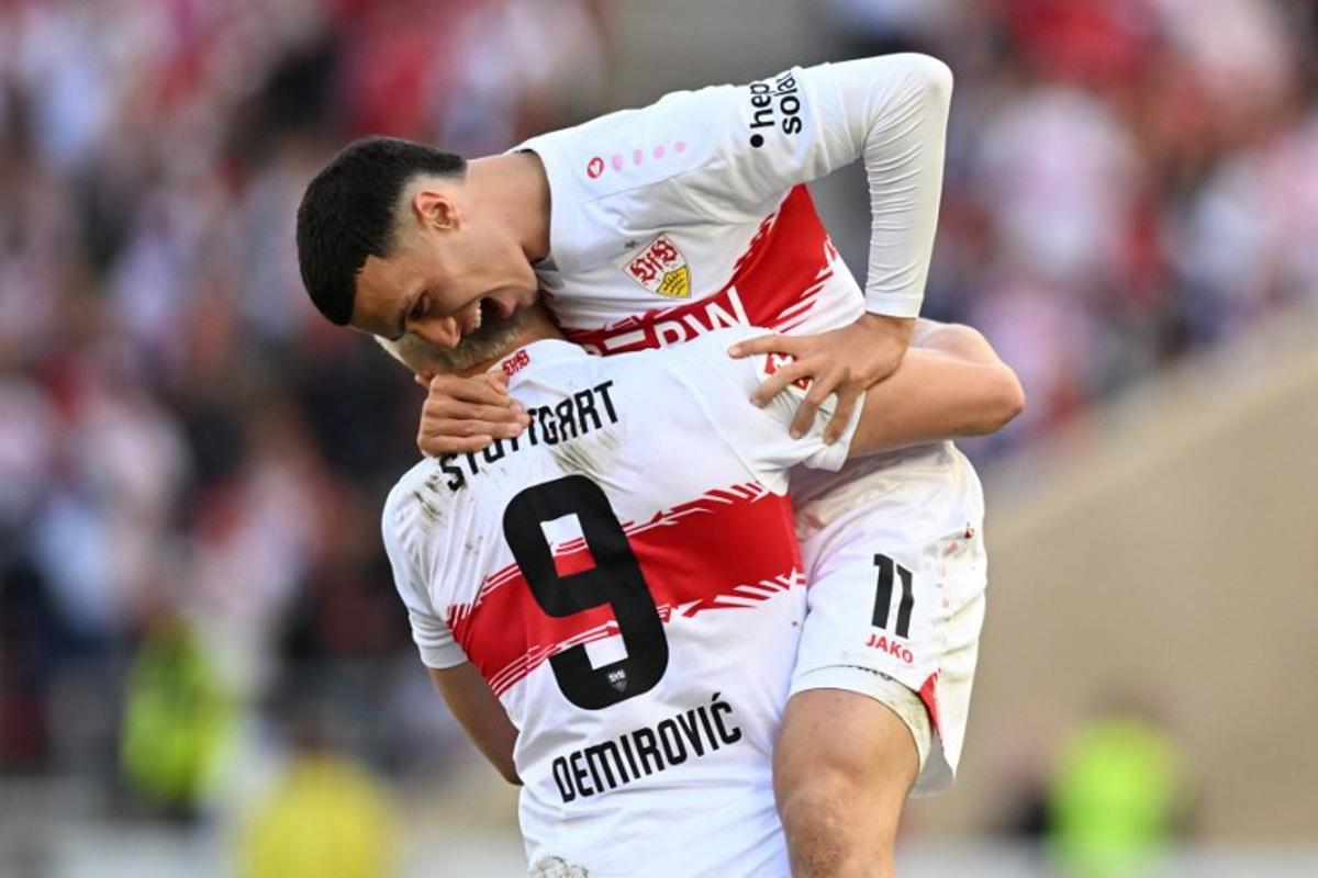 Stuttgart's Bosnian forward #09 Ermedin Demirovic celebrates scoring the equalising goal 1:1 with Stuttgart's German-Marrocan forward #11 Bilal El Khannouss during the German first division Bundesliga football match between VfB Stuttgart and SV Werder Bremen in Stuttgart, southwestern Germany on April 26, 2026. THOMAS KIENZLE / AFP