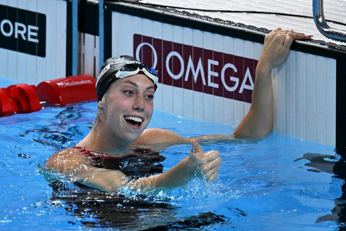 US' swimmer Gretchen Walsh celebrates winning the final of the women's 50m butterfly swimming event during the 2025 World Aquatics Championships in Singapore on August 2, 2025. Oli SCARFF / AFP