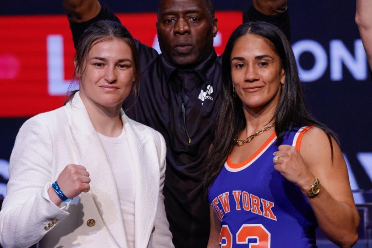 Irish boxer Katie Taylor (L) and Puerto Rican boxer Amanda Serrano pose at a press conference at the Apollo Theatre in New York, on May 13, 2024. Kena Betancur / AFP