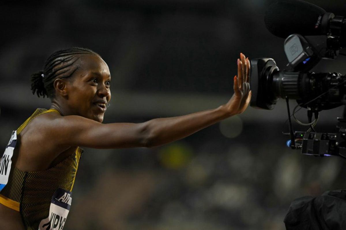 Kenya's Faith Kipyegon celebrates after winning the Women's 1500m final of the Memorial Van Damme Diamond League athletics finals at the Roi Baudouin Stadium in Brussels on September 14, 2024. NICOLAS TUCAT / AFP