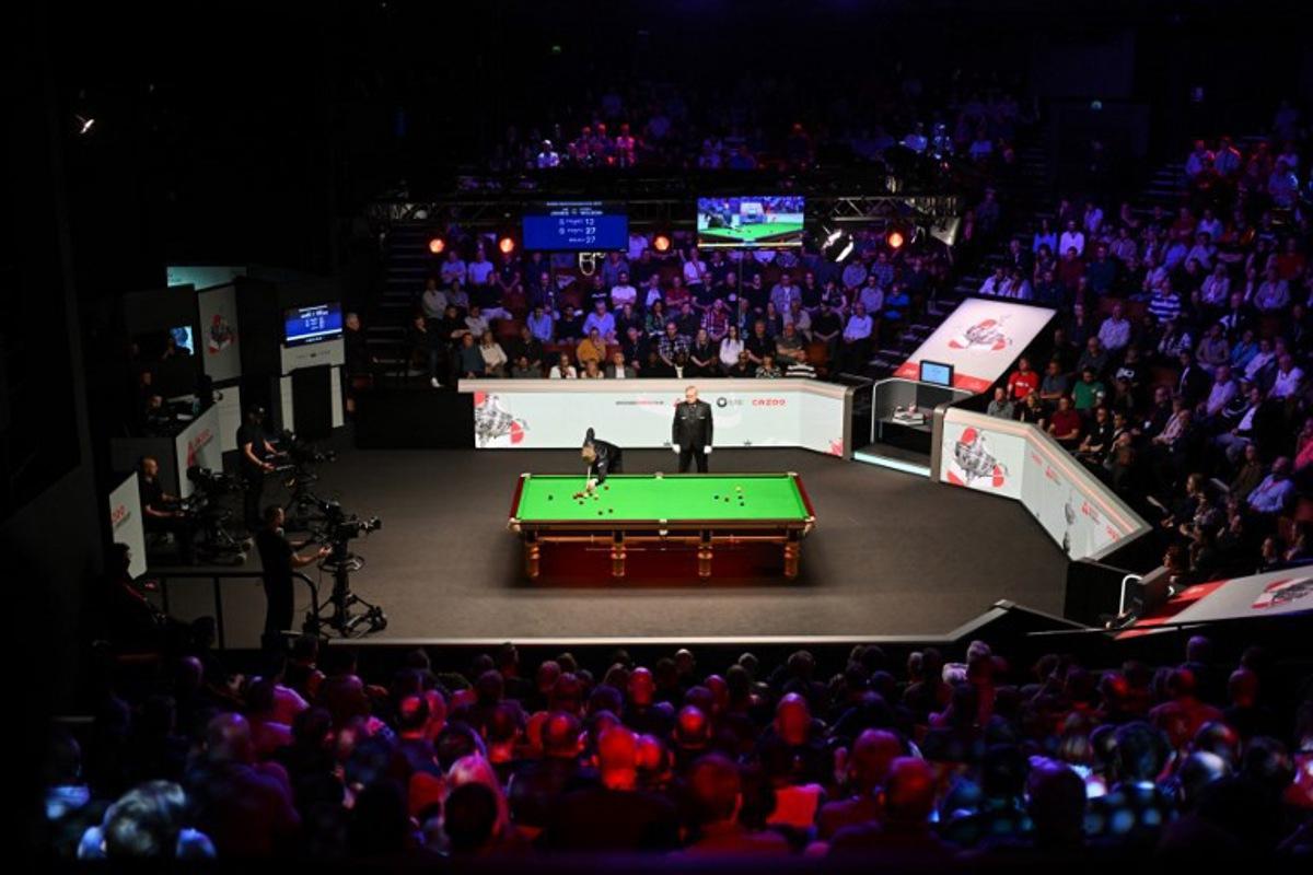 England's Kyren Wilson plays a shot on day two of his World Championship Snooker final against Wales' Jak Jones during the afternoon session at The Crucible in Sheffield, northern England on May 6, 2024. Oli SCARFF / AFP