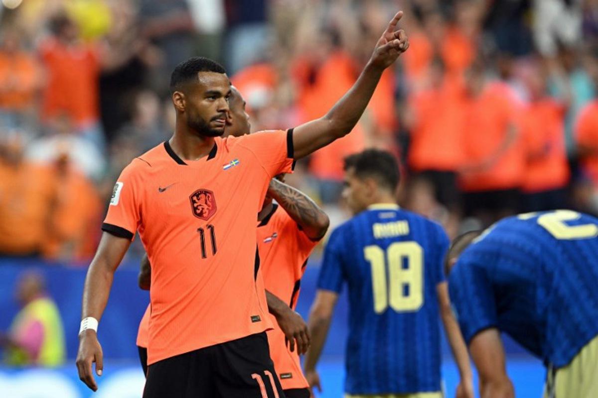 Netherlands' forward #11 Cody Gakpo celebrates scoring his team's fourth goal during the 2026 World Cup Group F football match between the Netherlands and Sweden at the Houston Stadium in Houston on June 20, 2026. RONALDO SCHEMIDT / AFP
