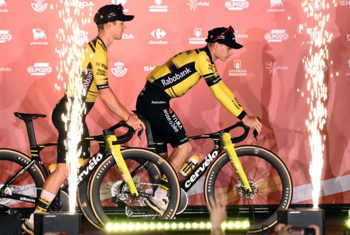 Team Visma-Lease a bike's Danish rider Jonas Vingegaard (R) rides his bike on stage during the official teams presentation of the 80th edition of 'La Vuelta' cycling tour of Spain, in Torino, Italy on August 21, 2025. Marco BERTORELLO / AFP