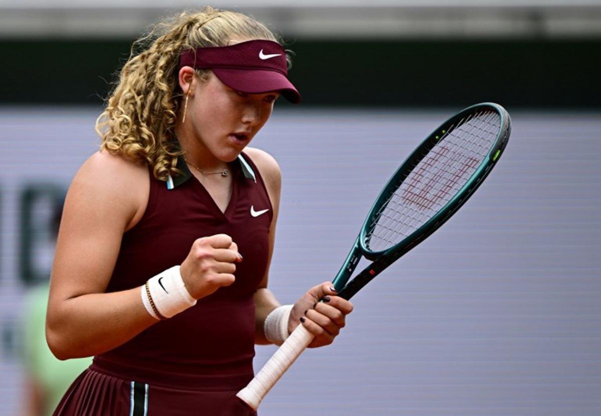 Russia's Mirra Andreeva reacts after a point during her women's singles match against Kazakhstan's Yulia Putintseva on day 7 of the French Open tennis tournament on Court Suzanne-Lenglen at the Roland-Garros Complex in Paris on May 31, 2025. JULIEN DE ROSA / AFP