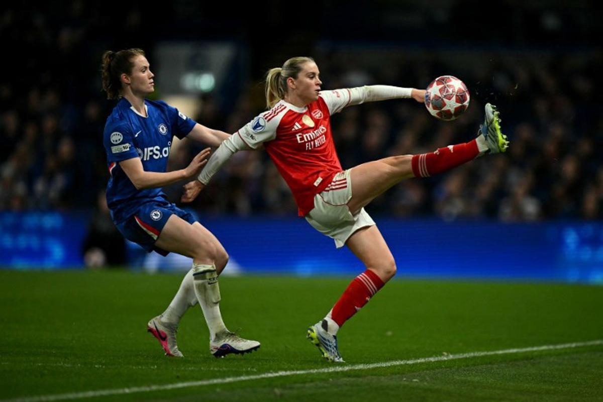 Arsenal's English striker #23 Alessia Russo is put under pressure by Chelsea's Dutch centre-back #05 Veerle Buurman during the UEFA Women's Champions League Quarter Final second-leg football match between Chelsea and Arsenal at Stamford Bridge in London on April 1, 2026. Ben STANSALL / AFP