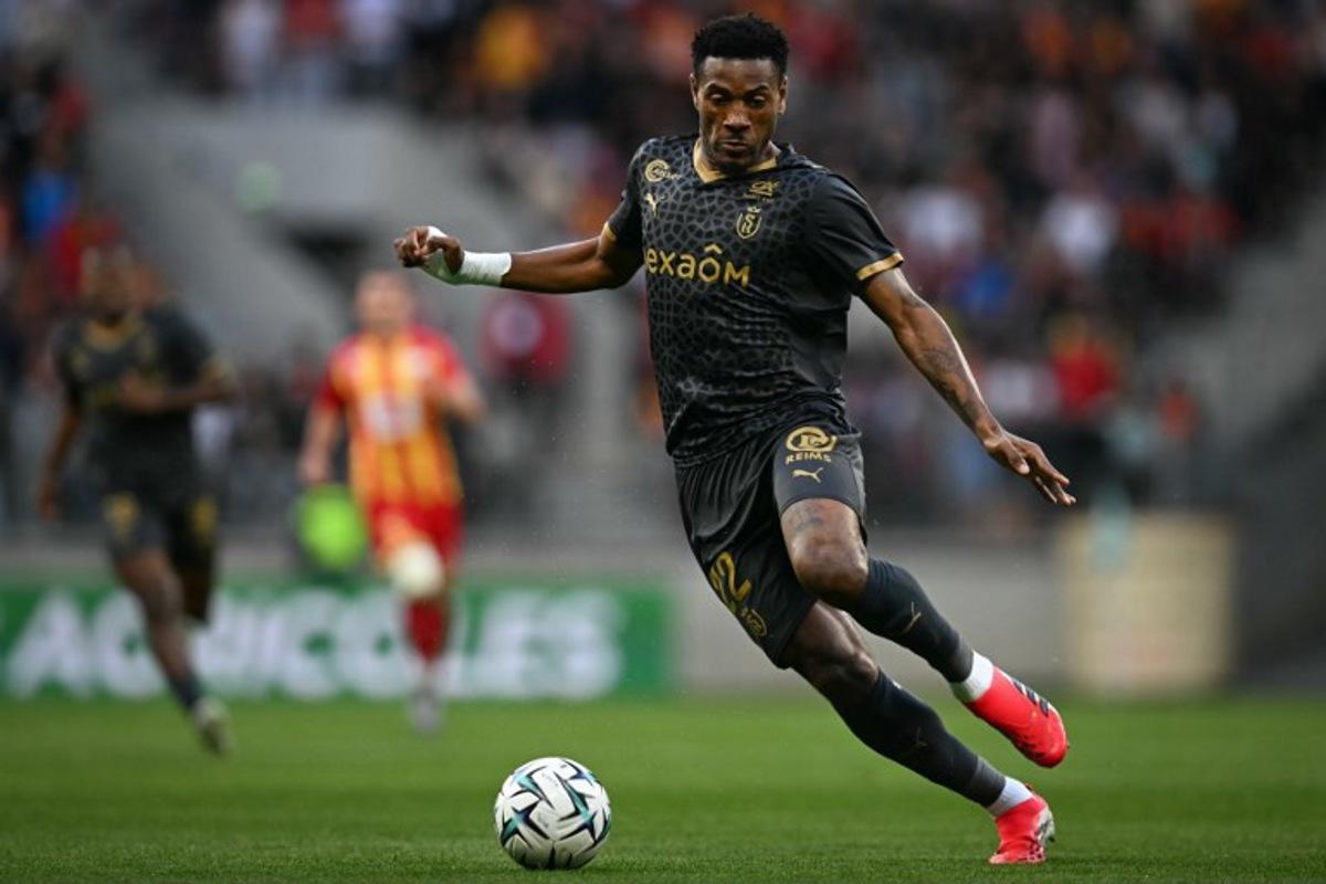 Stade de Reims' Cameroonian defender #22 Samuel Kotto controls the ball during the French L2 football match between Le Mans and Stade de Reims at the stade Marie-Marvingt in Le Mans, north-western France, on May 2, 2026. Lou BENOIST / AFP