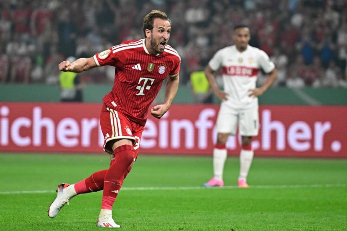Bayern Munich's English forward #09 Harry Kane celebrates scoring the 3-0 goal from the penalty spot during the German Cup (DFB Pokal) final football match FC Bayern Munich v VfB Stuttgart at the Olympic Stadium in Berlin, on May 23, 2026. Tobias SCHWARZ / AFP