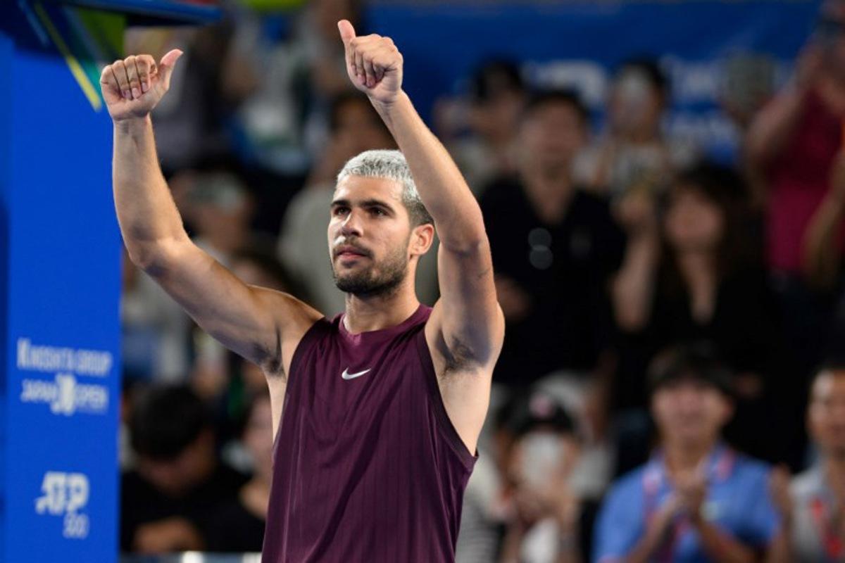 Spain's Carlos Alcaraz reacts after his men's singles match against USA's Brandon Nakashima at the ATP Japan Open tennis tournament in Tokyo on September 28, 2025. Philip FONG / AFP