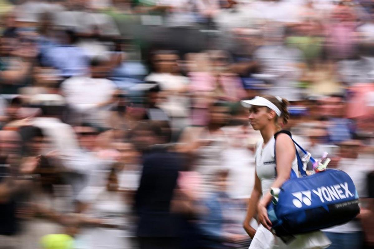 Belgium's Elise Mertens reacts as she leaves the Centre Court following her defeat against Belarus's Aryna Sabalenka during their women's singles fourth round tennis match on the seventh day of the 2025 Wimbledon Championships at The All England Lawn Tennis and Croquet Club in Wimbledon, southwest London, on July 6, 2025. Kirill KUDRYAVTSEV / AFP