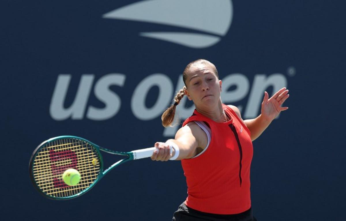 Diane Parry of France plays a shot to Ukraine's Marta Kostyuk during their women's singles third round match on day seven of the US Open tennis tournament at the USTA Billie Jean King National Tennis Center in New York City, on August 30, 2025. TIMOTHY A. CLARY / AFP