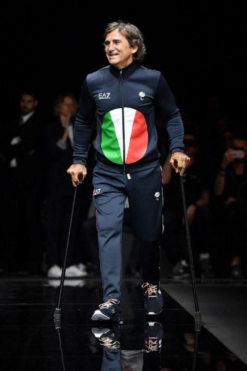 Italian professional racing driver and paracyclist, Alessandro Zanardi presents a creation for fashion house Emporio Armani during the presentation of its men's spring/summer 2020 fashion collection in Milan on June 15, 2019. Marco Bertorello / AFP