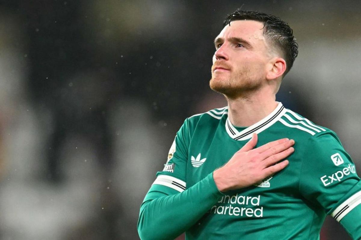 Liverpool's Scottish defender #26 Andrew Robertson applauds the fans following the English Premier League football match between Sunderland and Liverpool at The Stadium of Light in Sunderland in north east England on February 11, 2026. ANDY BUCHANAN / AFP