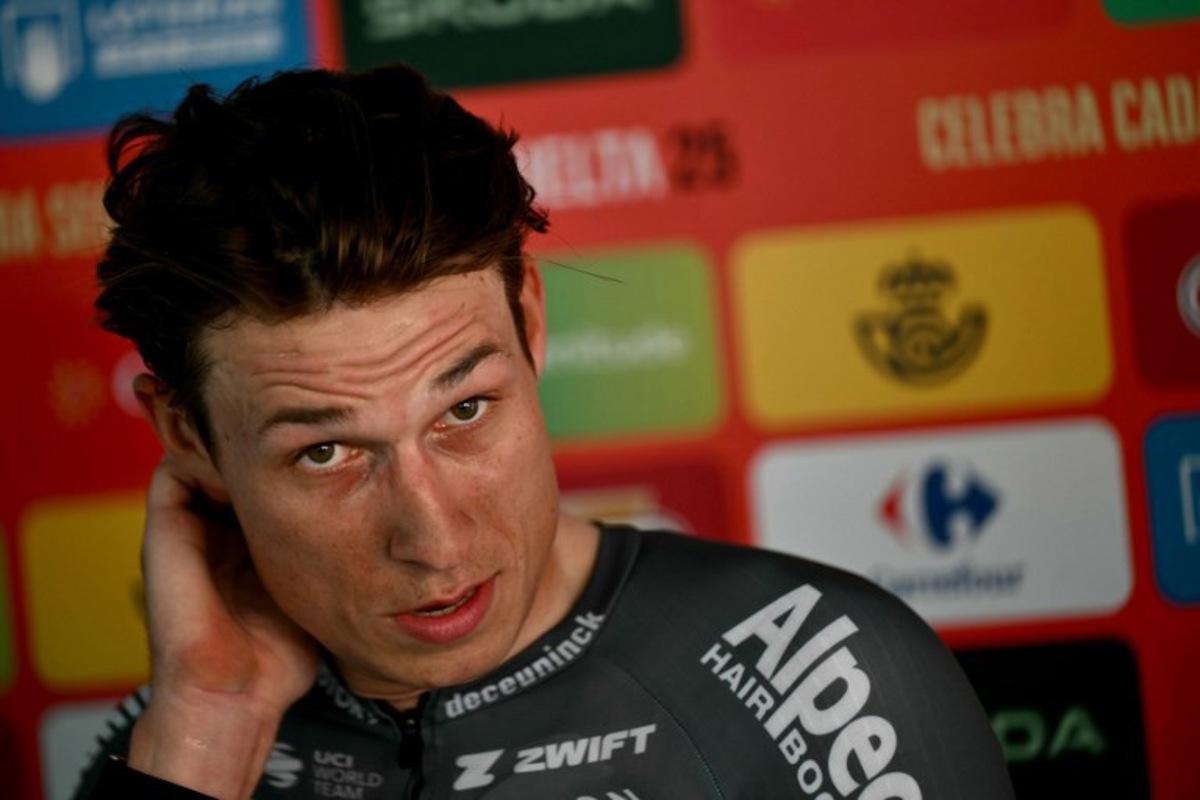 Team Alpecin's Belgian rider Jasper Philipsen looks on after winning the first stage of the Vuelta a Espana, a 183 km race between Torino - Reggia di Venaria and Novara, in Italy's Piemonte region, on August 23, 2025. Marco BERTORELLO / AFP
